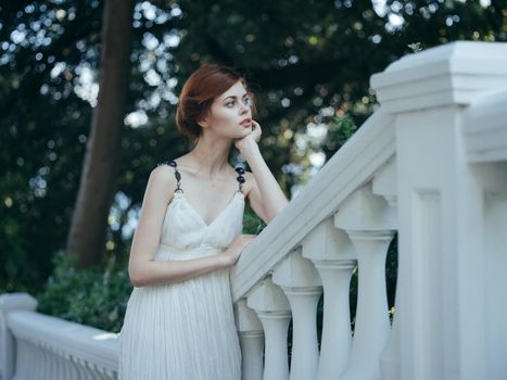 Beautiful woman in white dress classic style and luxury charm nature vacation. High quality photo