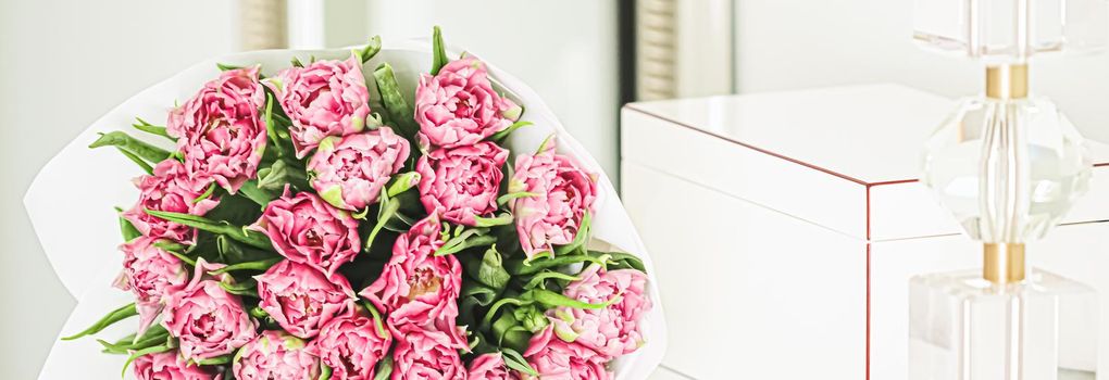 Bouquet of fresh cut pink tulips in an elegant interior, home decor closeup