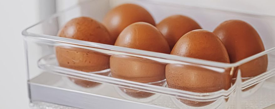 fresh eggs in refrigerator, dairy product closeup