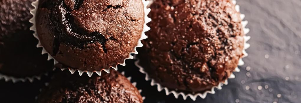 Homemade chocolate muffins, baked comfort food recipe concept