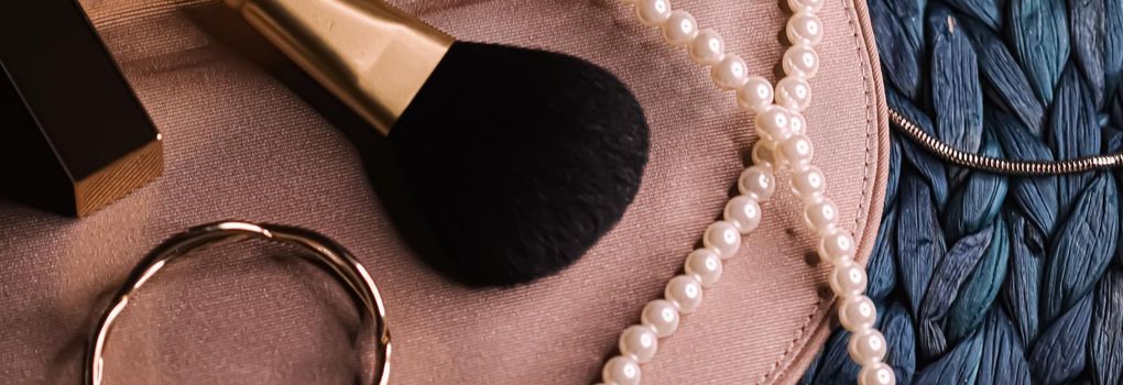 Jewellery and makeup tools inside a womans purse, beauty and fashion closeup