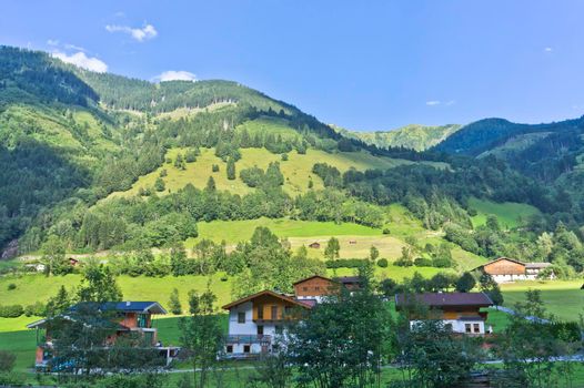 Assling, Natural landscape in Alps with small German style houses, Austria, Europe