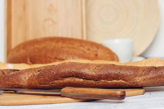 long loaf baked goods cutting board bread. High quality photo