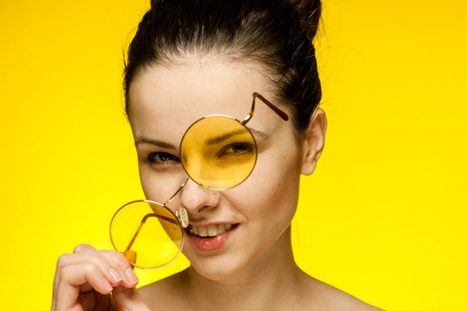 pretty woman with bare shoulders glasses in hands attractive look. High quality photo