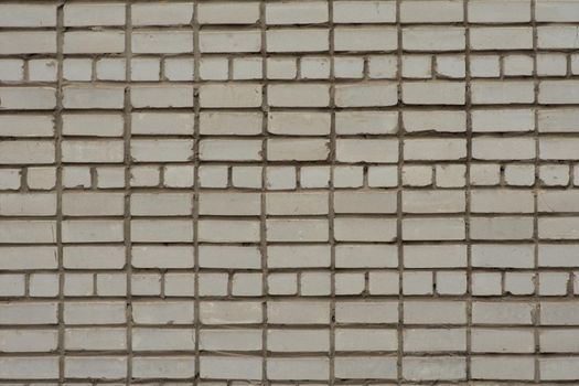 White brick wall. Part of the wall of a tall building. Texture