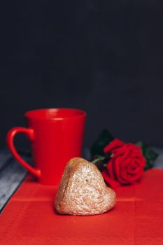 heart-shaped cookies on a red napkin rose flower snack. High quality photo