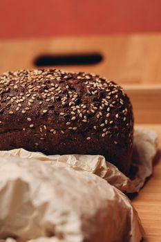 flour products baked goods on a wooden tray and a board in the background on the table. High quality photo