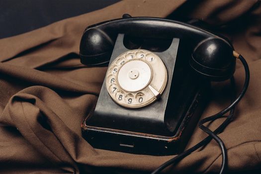 telephone vintage technology old style communication brown cloth. High quality photo