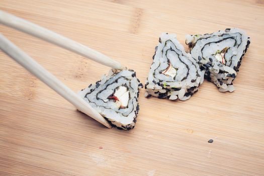 sushi chopsticks restaurant wood cutting board asian food. High quality photo