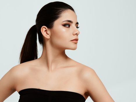 beautiful woman in black dress face makeup cropped. High quality photo