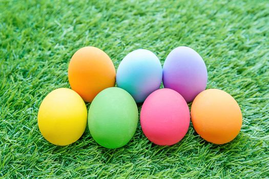 Close up Colorful easter eggs on on green gras background