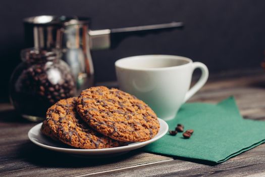 sweet biscuits coffee cup wooden table breakfast romance. High quality photo
