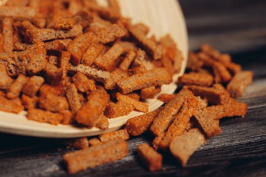 croutons on a plate snacks snack wooden table. High quality photo
