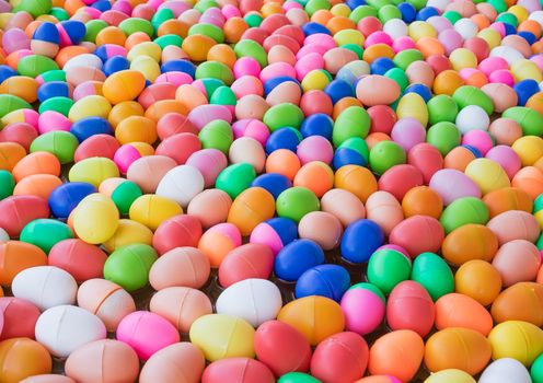 The Colorful easter eggs,Colorful plastic eggs toys floating on the water background