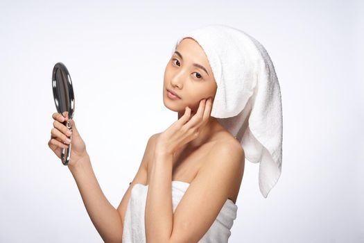 beautiful woman mirror in hands clean skin health lifestyle cosmetology. High quality photo