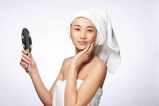 beautiful woman mirror in hands clean skin health lifestyle cosmetology. High quality photo