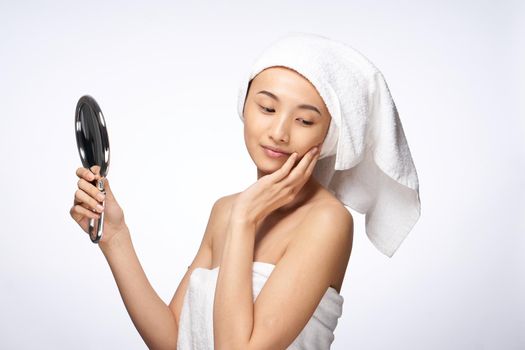 beautiful woman mirror in hands clean skin health lifestyle cosmetology. High quality photo