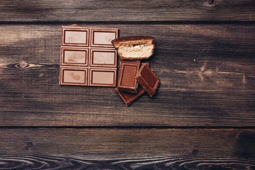chocolate sweets restaurant cocoa candy wooden background. High quality photo