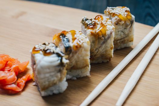 sushi chopsticks japanese cuisine red ginger top view. High quality photo