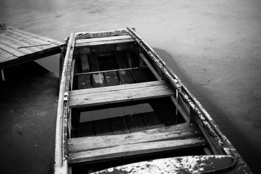 old wooden boat in the river near the pier nature landscape. High quality photo