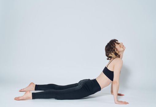 Women doing push-ups In a light room, sports meditation yoga asanas. High quality photo