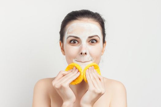 woman holding sponges in hands removing makeup. High quality photo