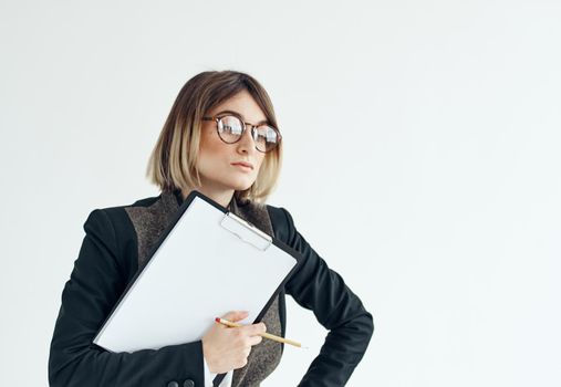 Woman download with documents in hands on a light background. High quality photo