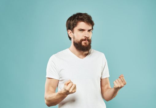 Cute man with beard on blue background emotions Copy Space cropped view. High quality photo