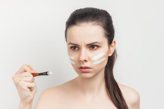 pretty woman naked shoulders face cream skin care cosmetology. High quality photo