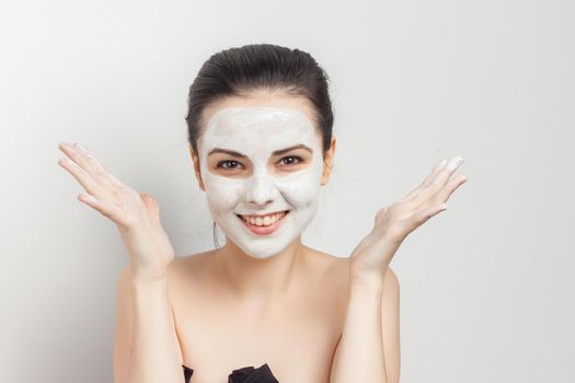 beautiful brunette naked shoulders face cream skin care. High quality photo