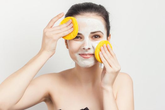 pretty woman with bare shoulders skin care makeup. High quality photo