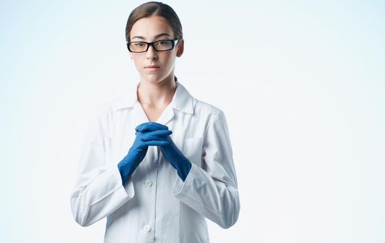 female doctor in a medical gown and blue gloves vaccination tests. High quality photo