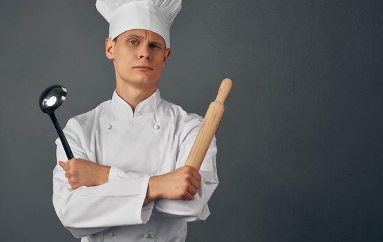 male chef kitchenware cooking in restaurant studio. High quality photo