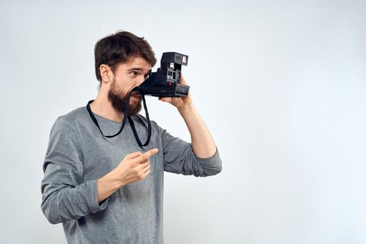 Male photographer holding a professional camera tasty technology hobby. High quality photo