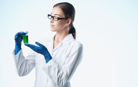 female doctor in a medical gown and blue gloves vaccination tests. High quality photo