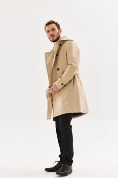 man in coat full length posing autumn fashion lifestyle. High quality photo