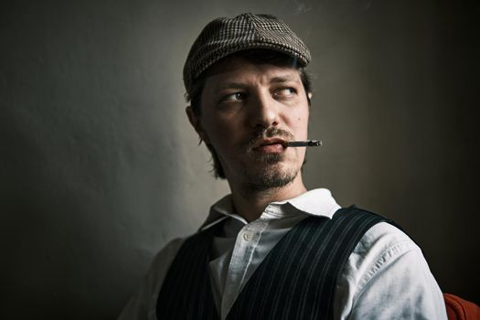 Young guy smoke cigarette, blows smoke, dressed in a retro style, in a beret, cinematic shot, big closeup