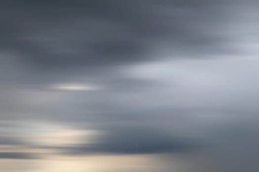 Abstract blurred nature background. Clouds in motion blur. Background for design and templates