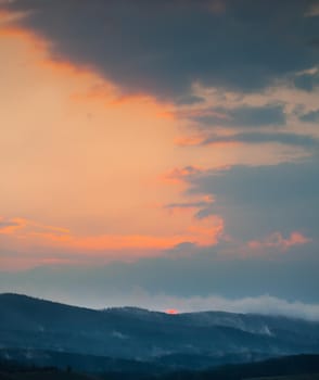 Beautiful sky with cloud during sunrise or sunset. Sunset clouds in the mountains. Abstract nature background.