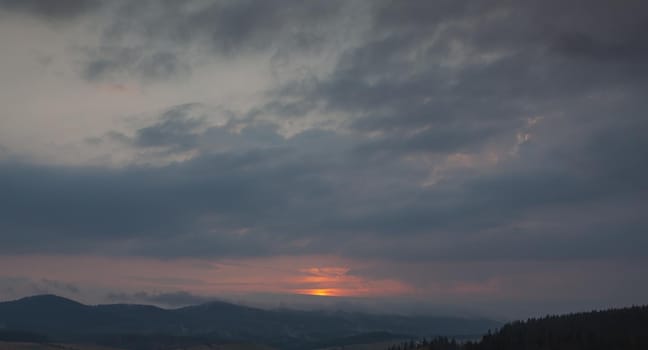 Beautiful sky with cloud during sunrise or sunset. Sunset clouds in the mountains. Abstract nature background.