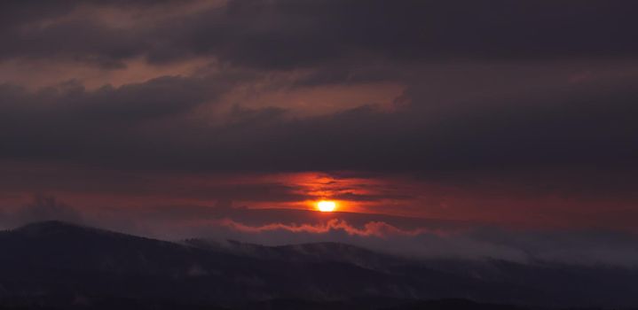 Beautiful sky with cloud during sunrise or sunset. Sunset clouds in the mountains. Abstract nature background.