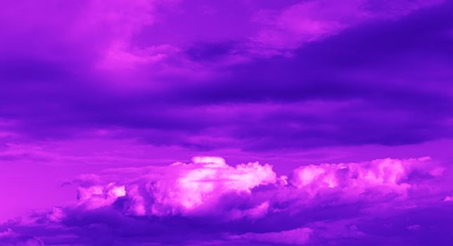 Abstract nature background. Sky with dramatic clouds. Image in trendy neon colors