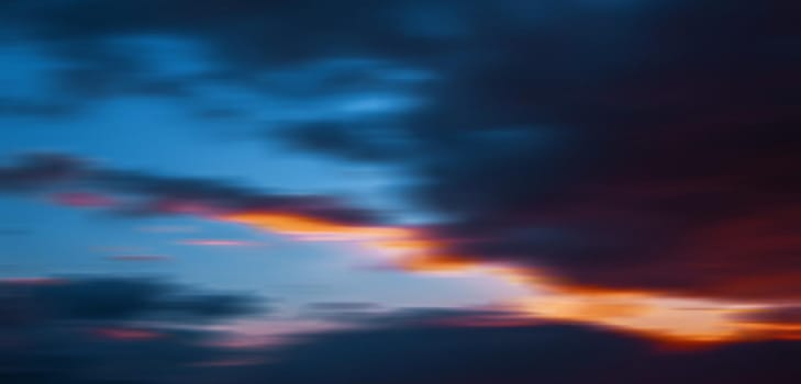 Abstract blurred nature background. Sky with dramatic clouds