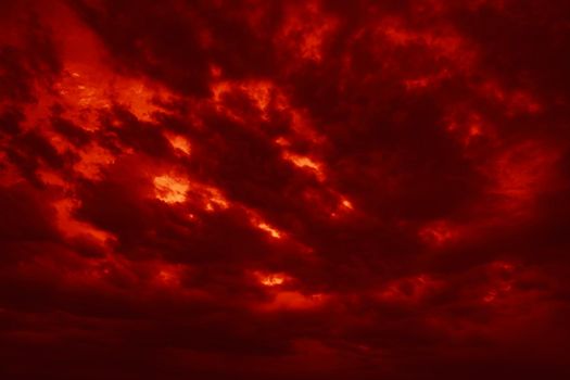 Nature background. Dramatic red clouds on the sky