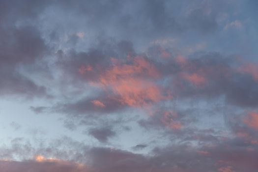 Abstract nature background. Colorful dramatic sky with cloud at sunset. Dramatic and moody pink, purple and blue cloudy sunset sky 