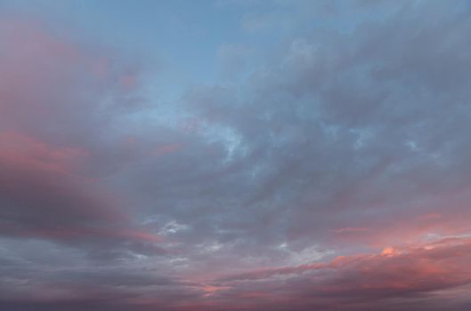 Abstract nature background. Colorful dramatic sky with cloud at sunset. Dramatic and moody pink, purple and blue cloudy sunset sky 