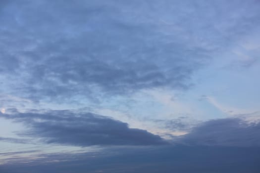 Evening sky with clouds and moon