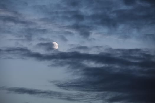 Evening sky with clouds and moon
