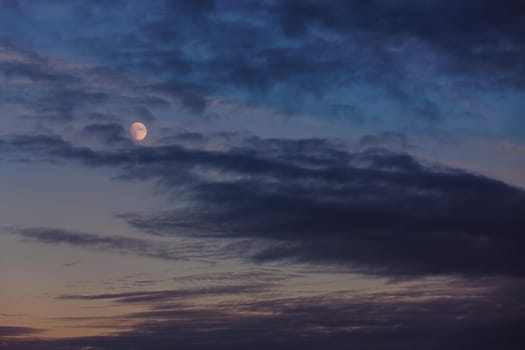 Evening sky with clouds and moon