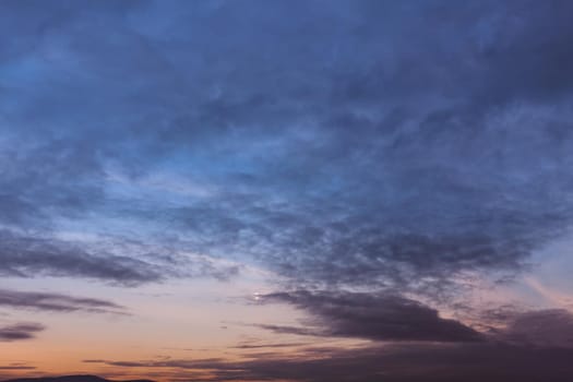 Evening sky with clouds and moon
